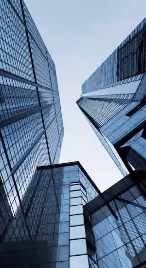Modern glass skyscrapers viewed from street level, NBR Group